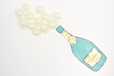 Make a fun champagne emoji decoration for your new year