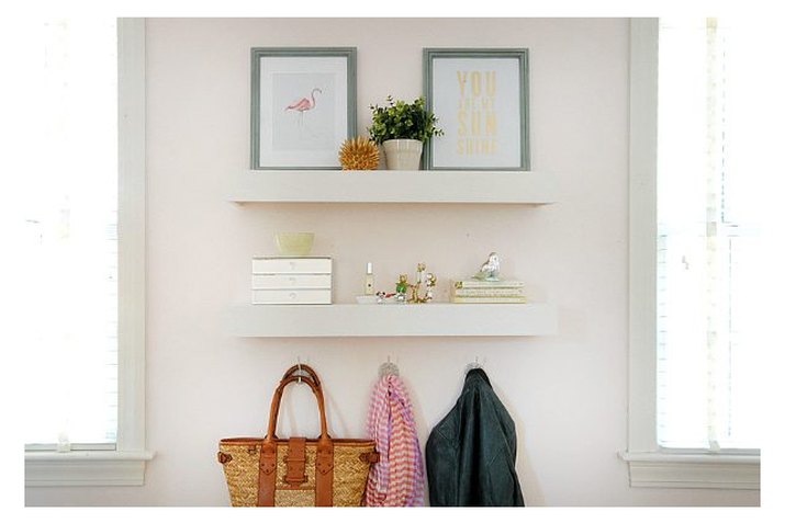 White floating shelves on a wall