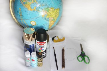 Supplies needed to create a painted globe.