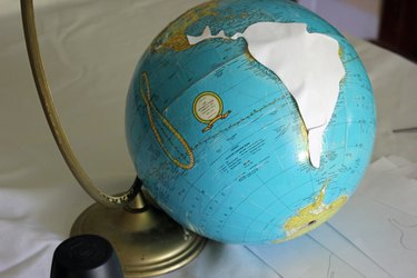 Tape the templates to the globe.