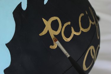 Paint the letters with gold acrylic paint.