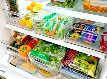organized refrigerator with clear plastic bins