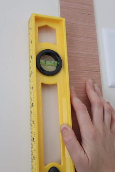 Checking to make sure the plank is level