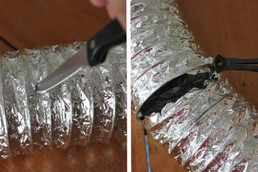 Cut the dryer vent hose with a sharp knife