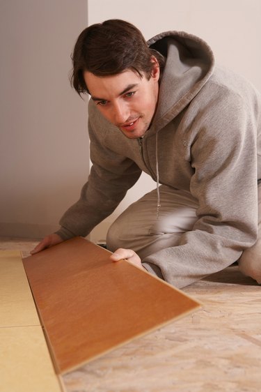 Man installing flooring