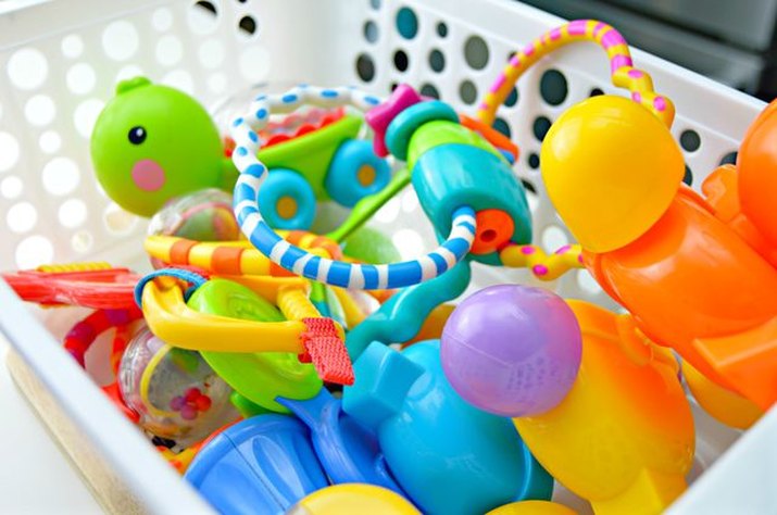 Laundry basket filled with clean, disinfected baby toys