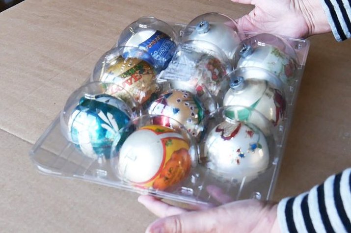 Use recycled plastic to store glass ornaments.