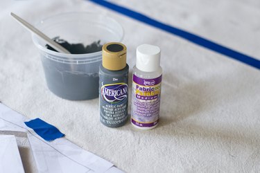 Use fabric paint to make the drop cloth washable.