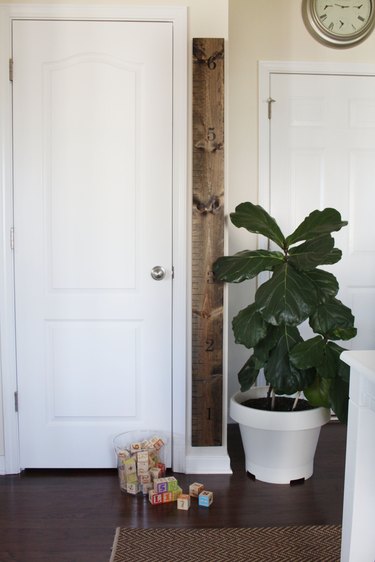 DIY wooden wall measuring stick growth chart