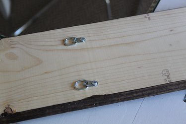 Hanging hardware attached to the back of the board