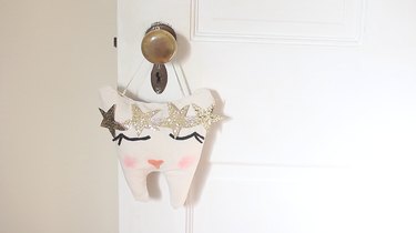 Tooth fairy pillow hanging on door knob
