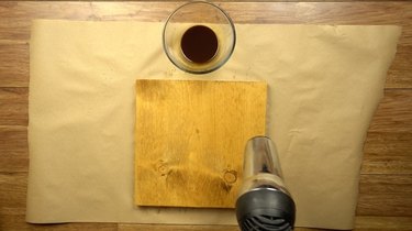 Drying instant coffee wood stain with hair dryer.