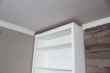 Bookcase with gap against ceiling.