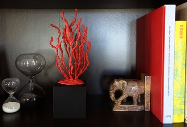 DIY faux coral sculpture on a bookshelf.