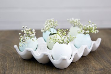 Eggs holder filled with decorated egg shells.