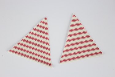 Cut out two triangles.