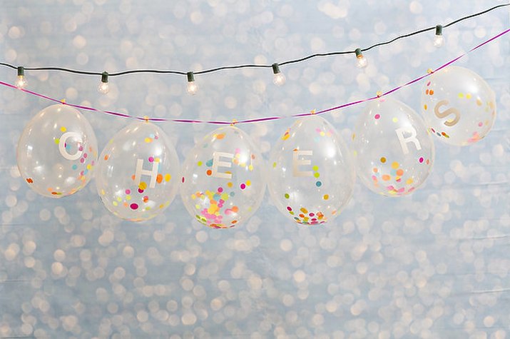 Clear balloons filled with confetti.